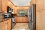 Fully equipped kitchen featuring a 29.5 cubic ft. wide refrigerator keeping all your favorite foods organized and within reach